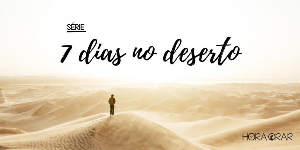 Homem parado no meio de um deserto.