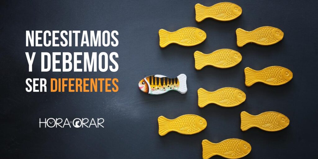 Varios peces iguales yendo a una dirección y un pez diferente va en en el sentido contrario